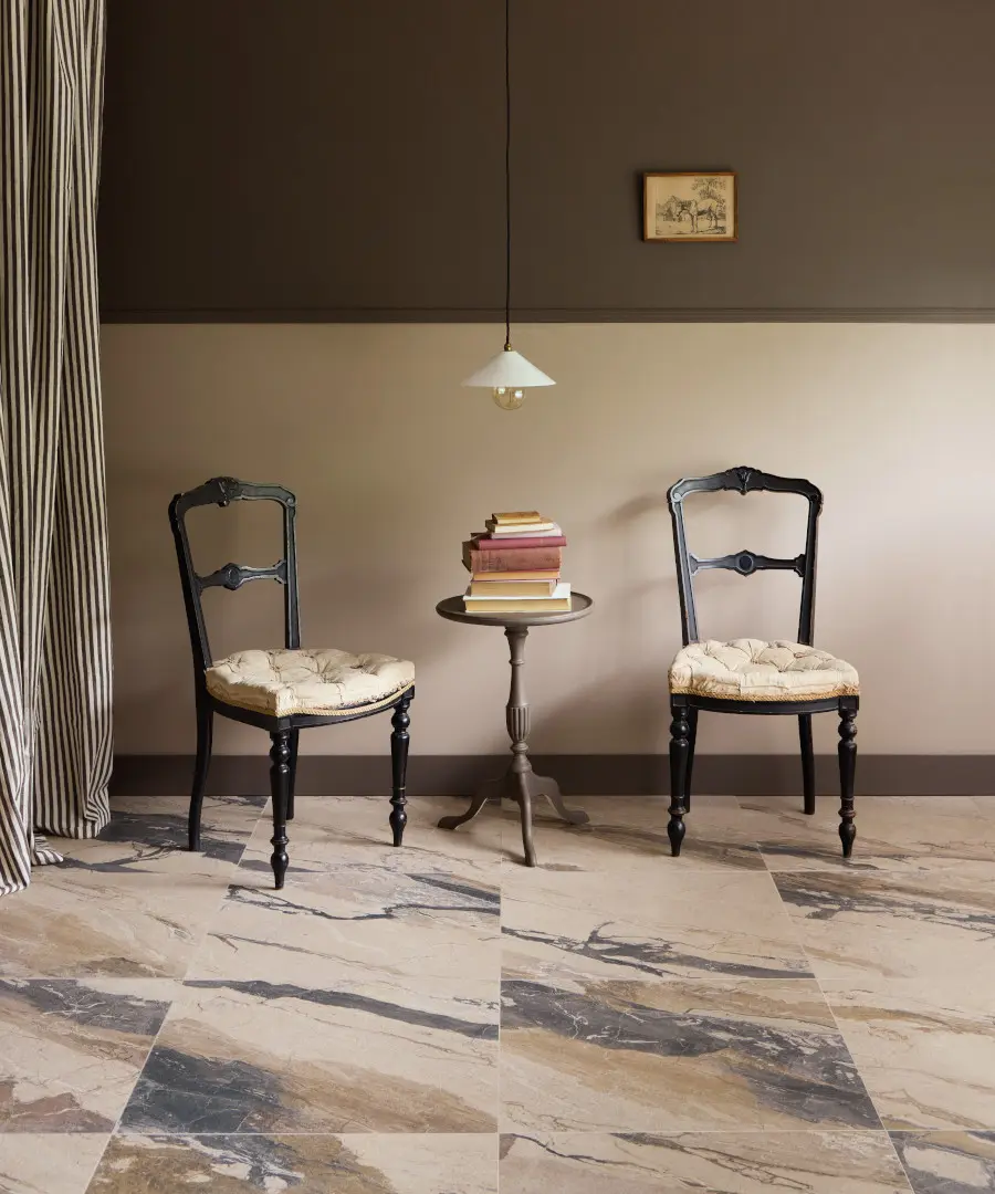 Rigoletto tiles, from Claybrook Studio with two chairs on a marble look tile floor