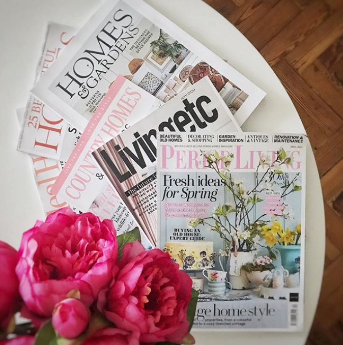 We love interior magazines! Interior lifestyle shot of a living room table with magazines.