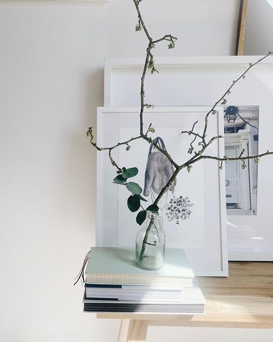 Styling foraged finds from a walk using delicate branches