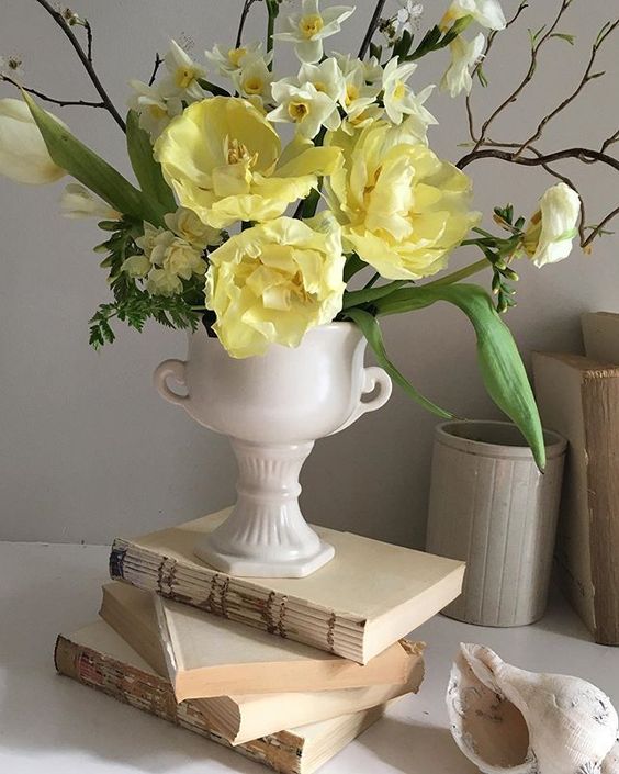 Styling foraged finds from a walk using yellow flowers