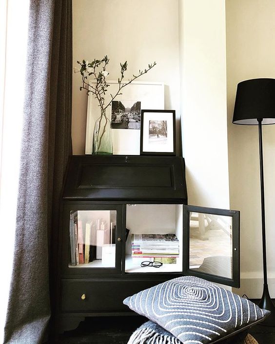 We love Interiors Magazines! Black dresser with magazines in.