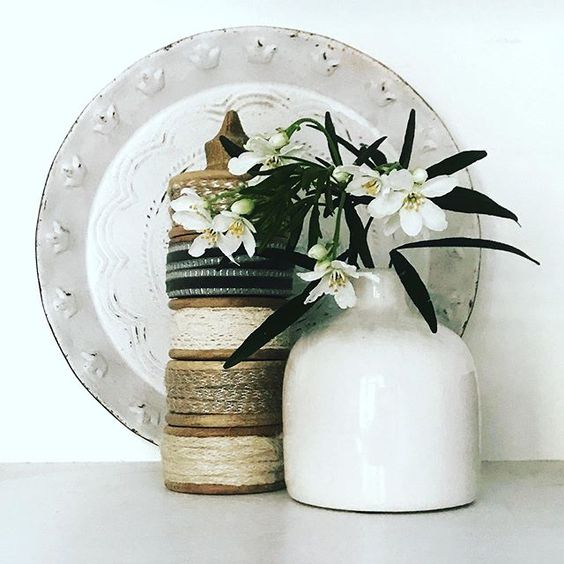 Styling foraged finds from a walk. A collections of vases with flowers 