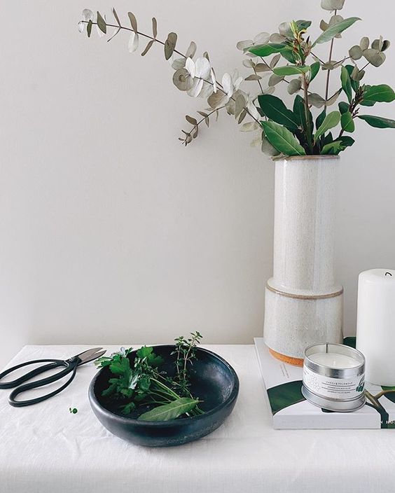 Styling foraged finds from a walk. Lifestyle image of flowers in a vase ad some gardening scissors