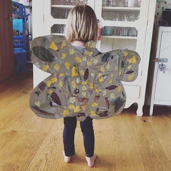 Styling foraged finds from a walk. A pair of butterfly wings made and worn by a child.