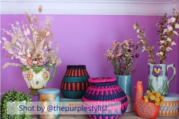 The secret styling tip for adding personality to your home that you need to know! Colourful baskets styled on a shelf in front of a purple wall