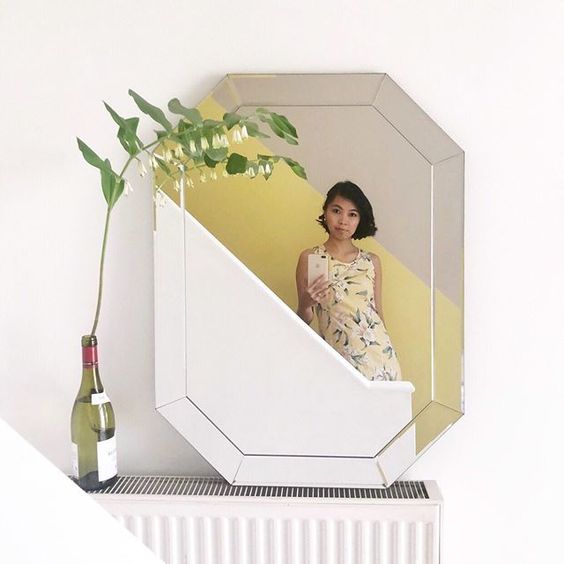 The top UK interior stylists you should be following. Picture of a woman in a mirror