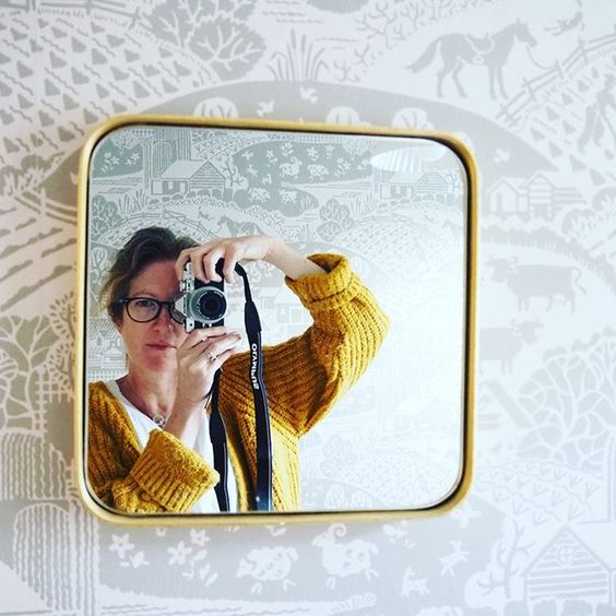 The top UK interior stylists you should be following. Picture of a woman taking a selfie in the mirror