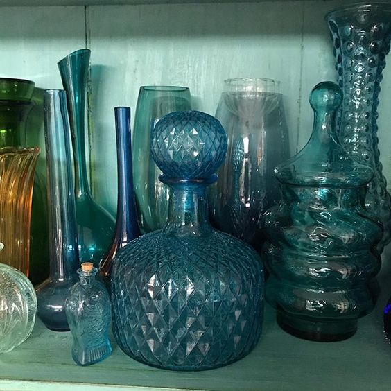 How to use colour in a room. Collection of colourful blue glassware