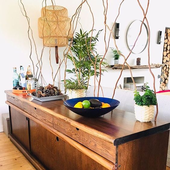 20 of the best vintage interiors in the UK. Vintage sideboard styled with vintage bowl and vases