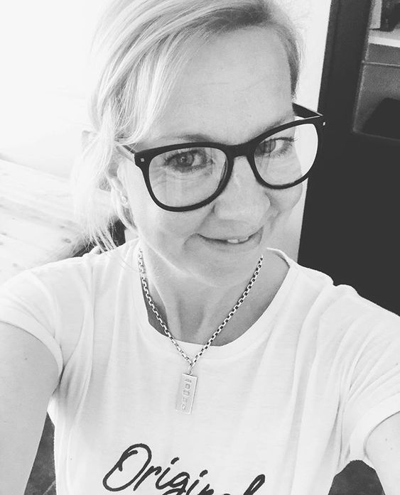The top UK interior stylists you should be following. Black and white image of a woman wearing glasses