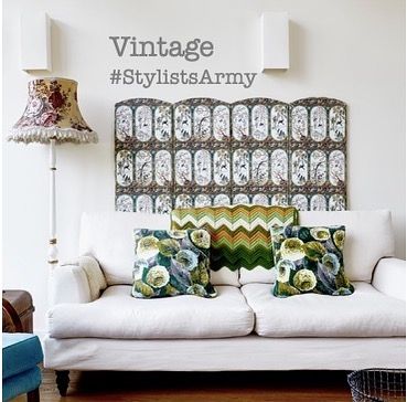 20 of the best vintage interiors in the UK. Vintage lamp and pillows on a white sofa