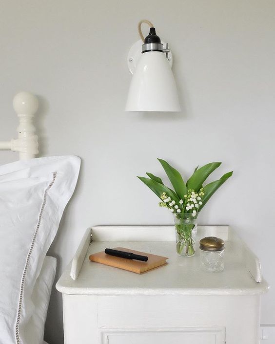 20 of the best vintage interiors in the UK. White bedroom with vintage accessories