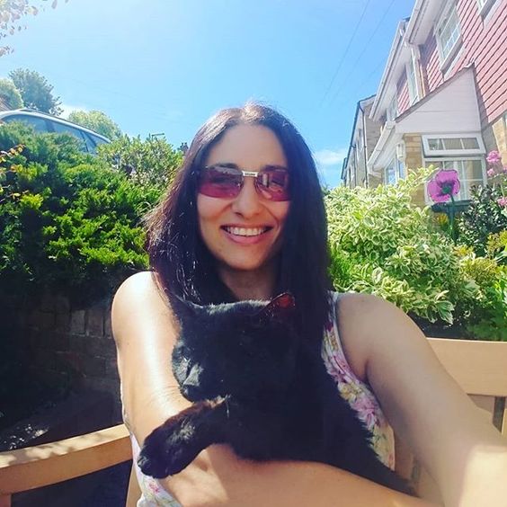 The top UK interior stylists you should be following. Selfie of a woman and her blind cat