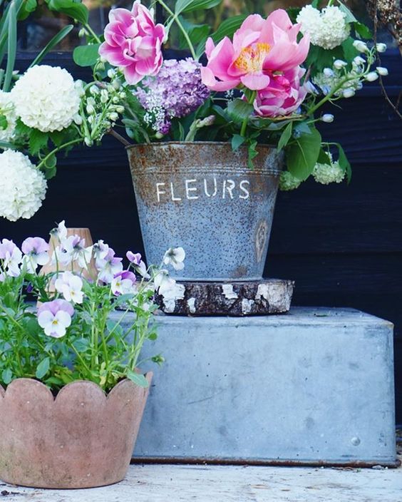 How to use colour in a room. Beautiful garden flowers styled in an antique French bucket