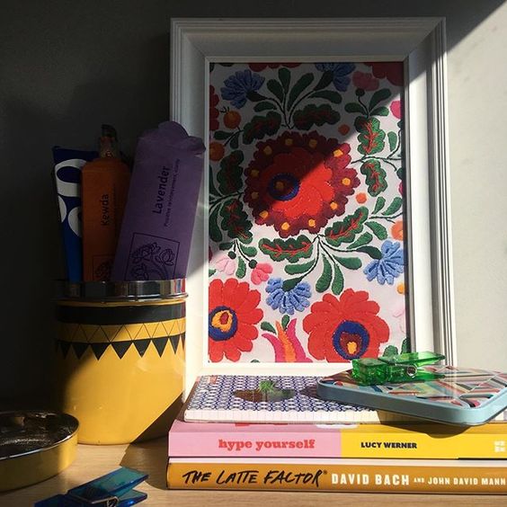 How to use colour in a room. Colourful floral print styled with some colourful books