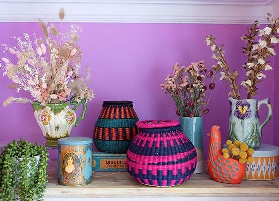 The secret styling tip for adding personality to your home that you need to know! Colourful baskets in front of a purple wall