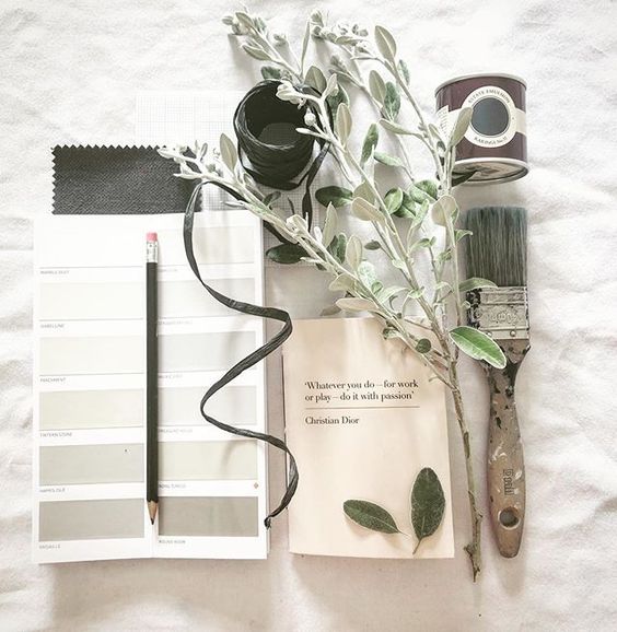 19 creative ways to use paper.Flat lay of interior design art materials, including a paint brush, paint swatches, flower and Farrow and Ball tester paint.