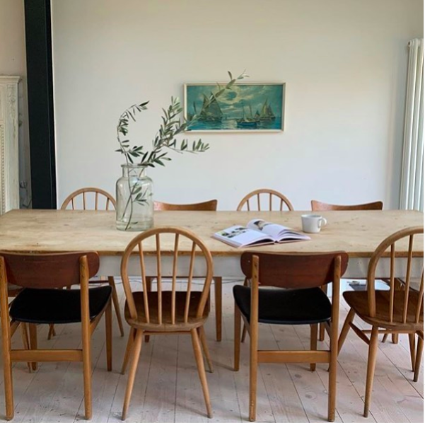 Lifestyle image of a wooden dining table and chairs