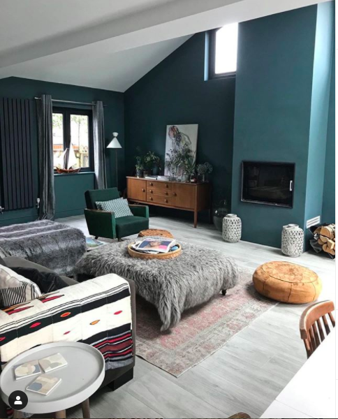 Lifestyle shot of a living room painted in blue/green hues