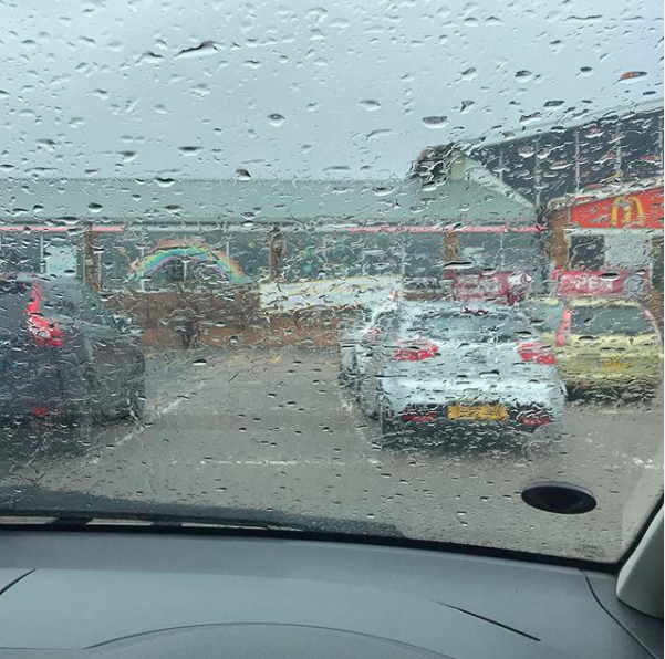 My happy place. Shot of a rainy scene through a car window of a car park.