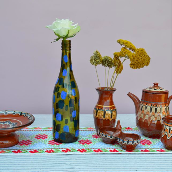 My Happy Place. Styled vases and jugs on a blue tablecloth.