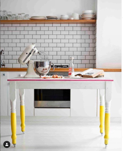 Kitchen table restyled with bright yellow table legs. Interior