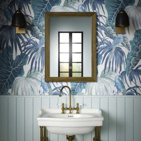 Blue wallpaper in a bathroom featuring leaves from the Amazon rainforest