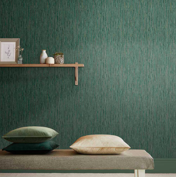 Living room wall papered with grasscloth textured wallpaper and featuring a simple wooden shelf with small accessories