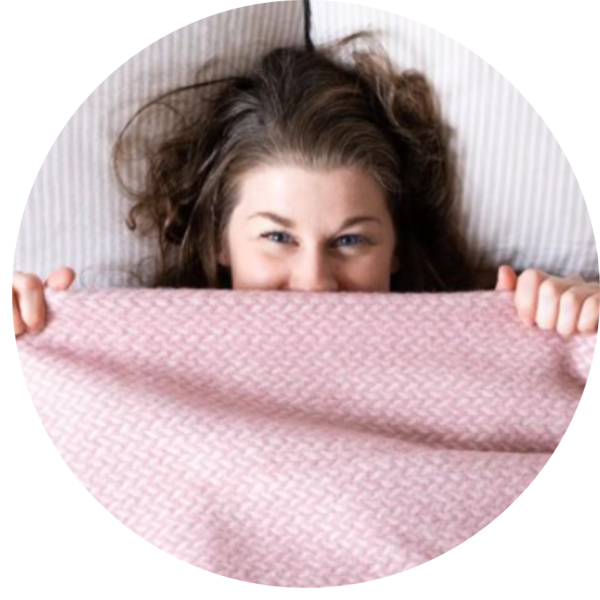 Bethan under a beautiful pink blanket 