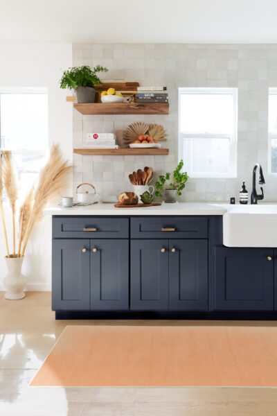 Pantones Colour of the Year 2024 Peach Fuzz coloured Rug by Ruggable in front of a grey kitchen cabinet