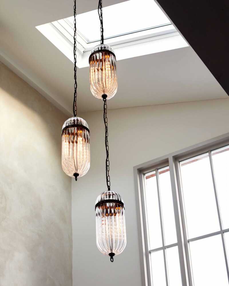 Cluster lights in glass above a staircase 