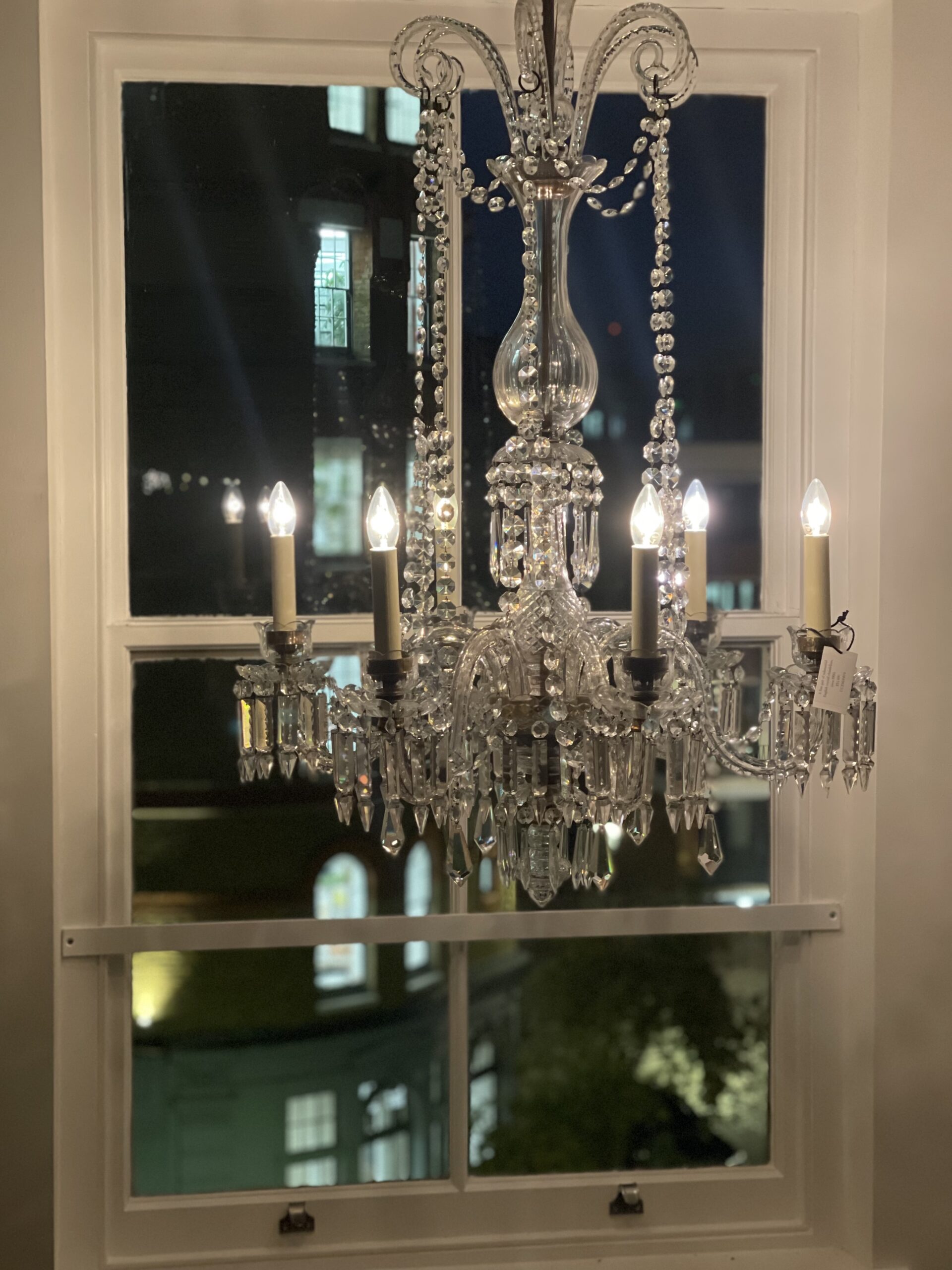Antique chandelier restored by Fritz Fryer and hanging in the London Showroom 