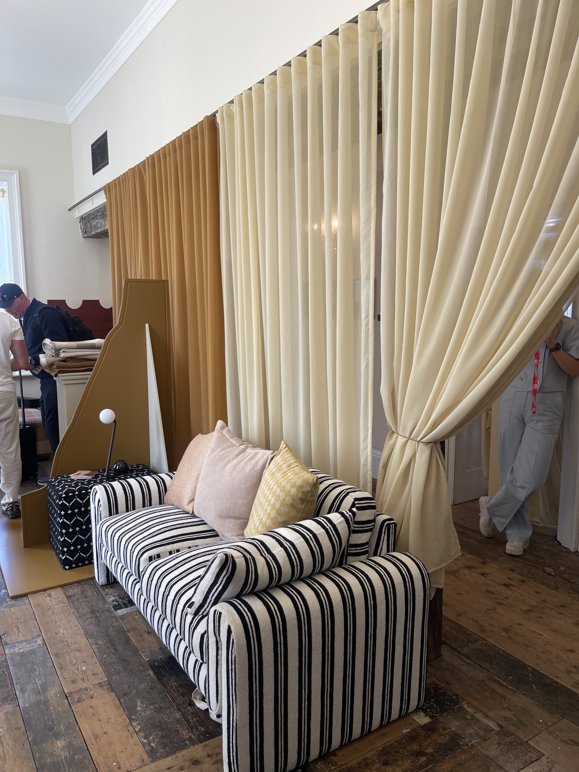 Kirkby Designs fabrics on a beautiful striped sofa with voiles in the background 