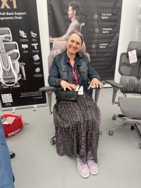 Emma Morton-turner sitting on a Hinomi office chair looking very comfortable