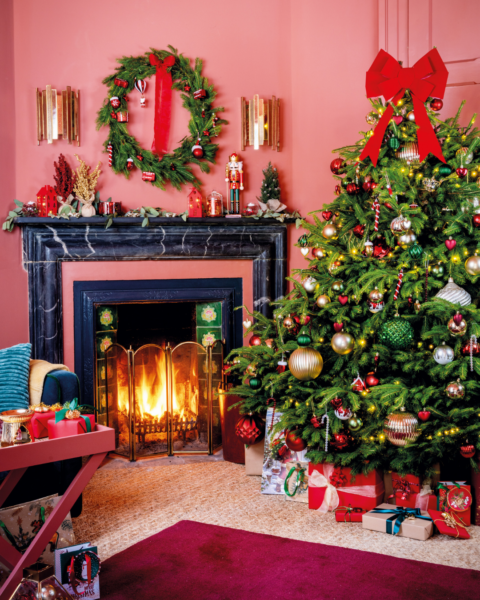 Christmas tree in pink living room with big Christmas tree