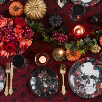 Halloween dining table styled by an interior stylist with black décor, seasonal accessories and branded products for a commercial photoshoot.