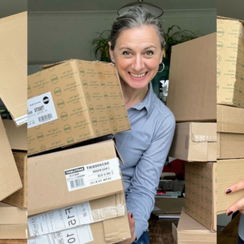 Interior stylist Emma Morton-Turner holding a stack of boxes saved for props and styling shoots.