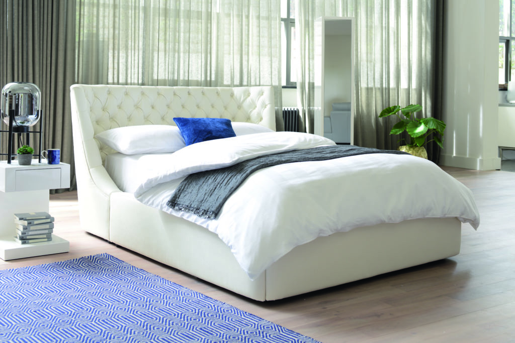 White bed blue