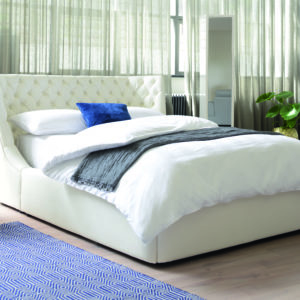 White bed blue 